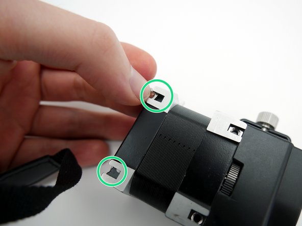 Insert x2 M3 square nuts into the empty T-slots on the back side of Hemera.