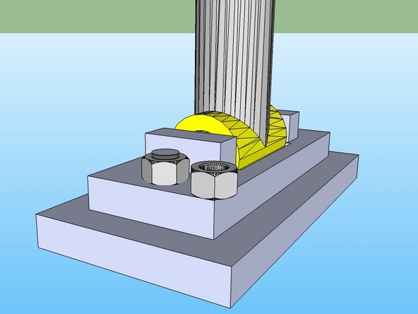 Weld the nut in the corner of the lower press plate, as shown. This should be on the opposite side of the ports of the cylinder, flush with the press foot, and as near to the corner as you can get it. It can even hang off a bit.