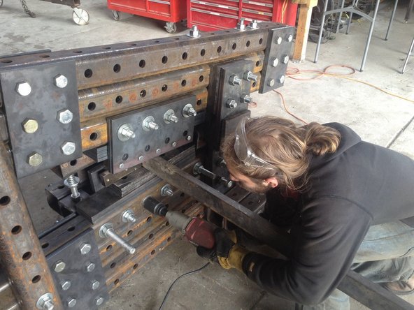 Repeat the same for the lower blade holder bolts