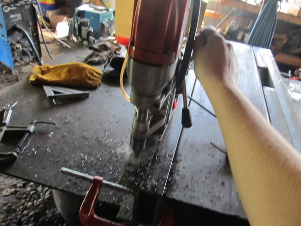 Use a Mag-Drill to drill the 3/4" holes each place where the horizontal members overlap the vertical members.