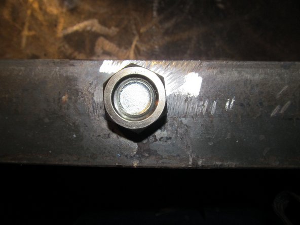Weld it with a bolt coming thru the other side so it protects the threads and so you know the nut won't get off center.