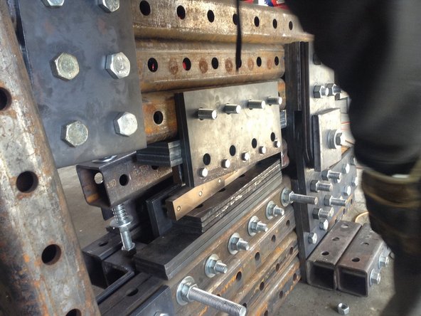 Mount the spacer plate in the blade assembly. Mount blade assembly back on the ironworker.