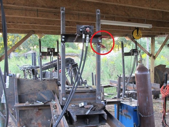 Place the shaker onto the bolts already welded to the hopper supports.