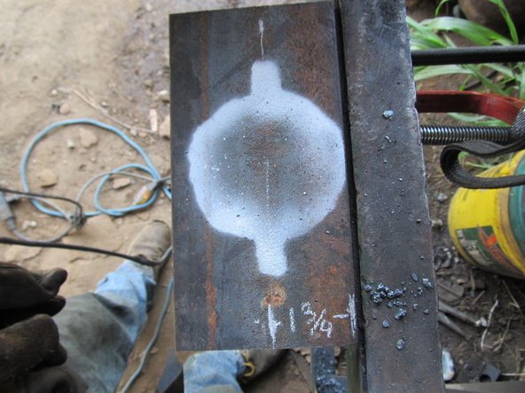 Double check that the hole is large enough by putting on the motor and making sure the raised portion in the center goes all the way thru.