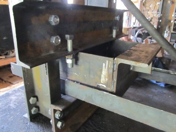 Insert the Soil loading drawer on top of the horizontal members so that the press plate is facing the press feet.