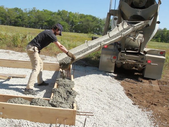 Pour concrete into foundation forms. Fill the foundation forms with concrete and smooth off the top with a screed board. We had a truck deliver the concrete, but you could also mix it yourself in a concrete mixer or in a wheelbarrow with a mixing hoe.