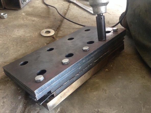 Mount the spacer plate in the blade assembly. Mount blade assembly back on the ironworker.