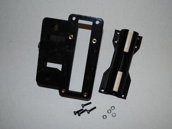 ASSEMBLE DOUBLE BEARING HOLDER ONTO X END IDLER