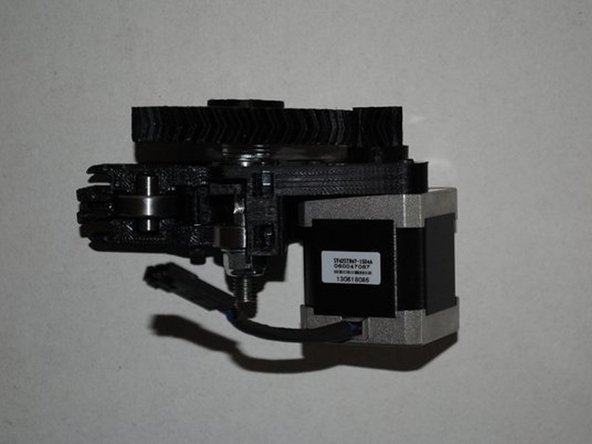 Holding the motor in the location where it will be mounted, align the herringbone gears by sliding the small gear in or out on the motor shaft so the V-grooves are centered on each other.