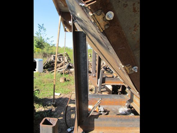 Bolt (3/4"x2.5" bolt)  The grate mounts through the hopper to the grate.