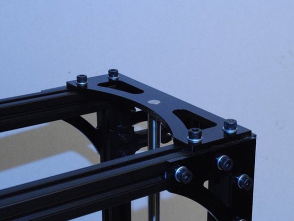 Slide a 10mm smooth rod up through the bottom of the left Z motor mount.