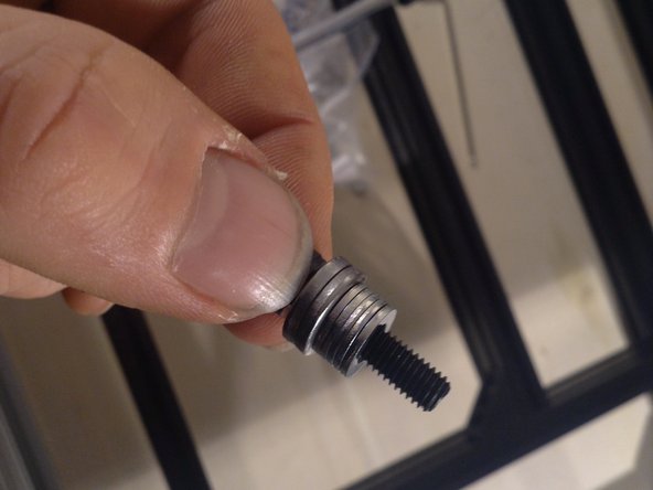 Use 2 larger washers and 5 smaller washers on a 20 mm screw, and then 3 more larger washers.