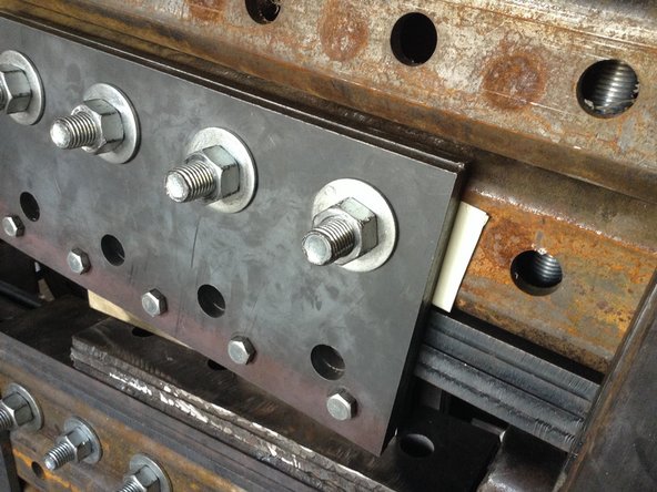 Insert The paper spacer under the blade mount plate