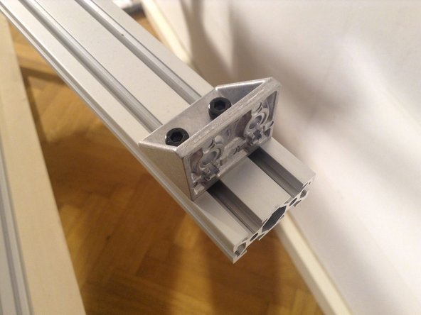 Mount rear horizontal, 2040 extrusion with 2 double brackets, and then mount the midpoint with a single bracket.