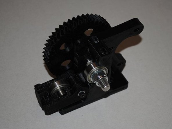 INSTALL IDLER ONTO BODY