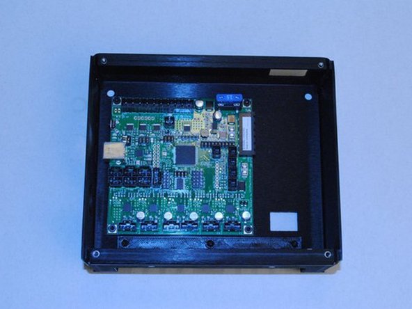 Using 4x M3 x 5 SHCS, install the RAMBo board into the electronics case.