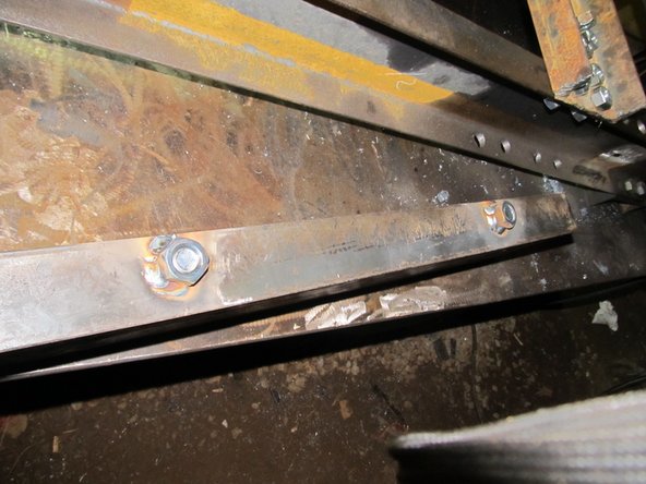 Weld 3/4" nuts to the outside of the U channel where the holes are torched.