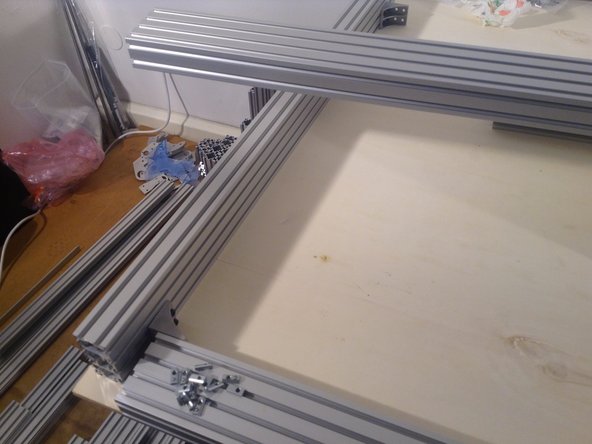 Insert the spring nuts on all corners, then bolt the 4 sides together.