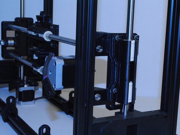 Once its through far enough, put the X carriage on the rod.