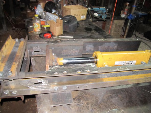 Lay the frame down, with all of the crossmembers and drawer members in place except the upper crossmember and drawer member which are facing up.