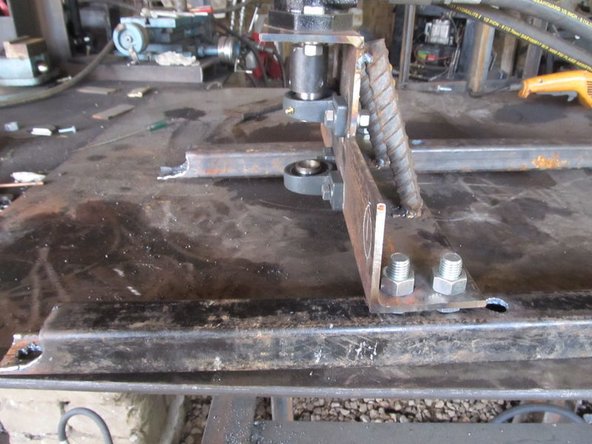 Get the Shaker Mount and tighten 3/4" bolts with nuts to the Soil Shaker so the bolt head is where the hammer will be.