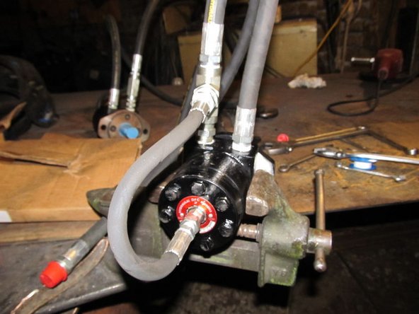 Tighten the tee assembly into the correct port (see the photo)