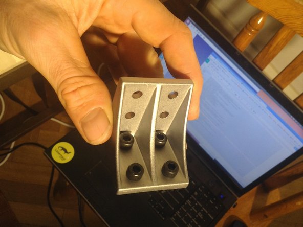 To install the corner brackets, put in the 4 screws in first.