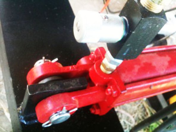 On the side which attaches to the secondary arm, put the pin through the mount, a 1" washer, and the cylinder.