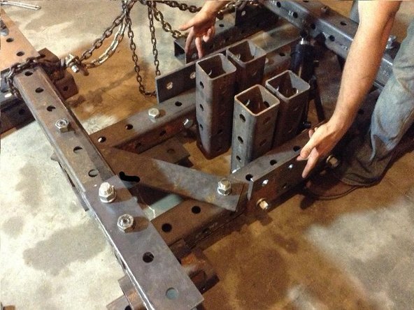 Attach two 2x4 hole Reinforcement Plates to the top and bottom Quick Attach tubes