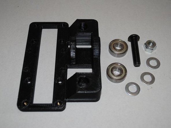 GATHER PARTS TO ASSEMBLE BEARINGS ONTO END IDLER
