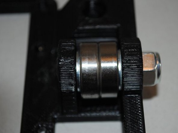 ASSEMBLE BEARINGS ONTO X END IDLER