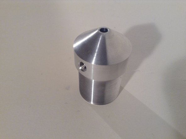 Gas nozzle - threaded so optics components can be put on it. Thread is defined 1.035"-40, 23 mm deep on the nozzle. Nozzle is found in CAD - FreeCAD has it. See Thor Labs for Lens Tube for corresponding threads.