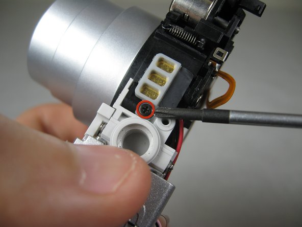 Disassembling Pentax Optio S4i Lens Assembly: step 27, image 1 of 2