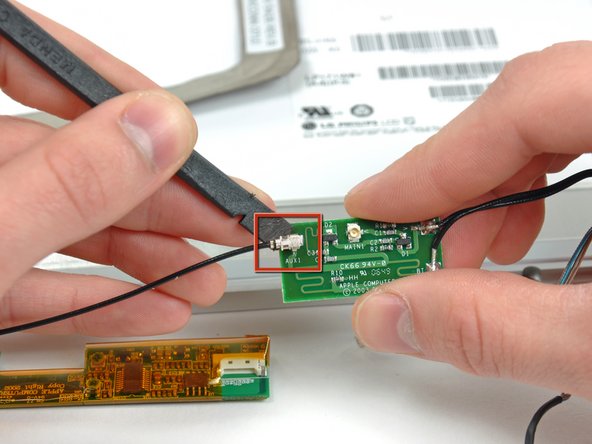 PowerBook G4 Aluminum 17" 1-1.67 GHz Front Display Bezel Replacement: step 36, image 2 of 2