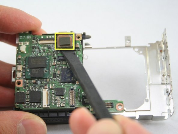 Disassembling Canon PowerShot SD1100 IS AV port and Logic board: step 24, image 1 of 2