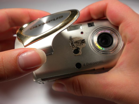 Olympus Stylus 410 Battery Cover Replacement: step 3, image 1 of 1