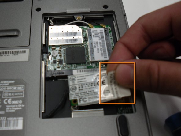 Removing the Dell Inspiron 1150 Modem Card: step 4, image 1 of 2