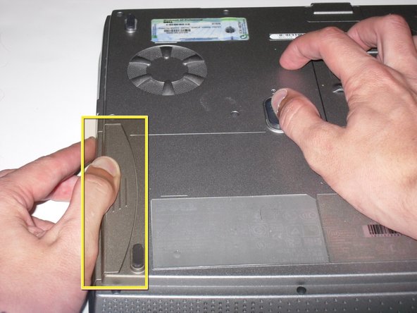 Removing the Dell Inspiron 1150 Modem Card, Removing the Dell Inspiron 1150 Modem Card: step 1, image 2 of 3