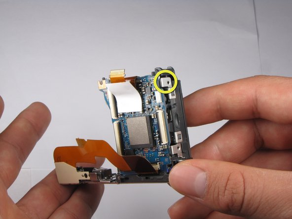 Repairing Sony Cyber-shot DSC-W290 Motherboard: step 22, image 1 of 3