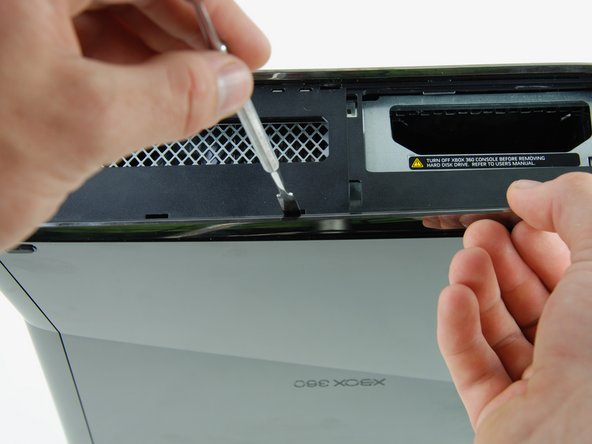 Xbox 360 S Faceplate Replacement: step 20, image 1 of 2