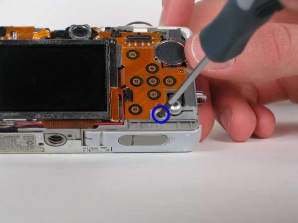 Canon PowerShot SD200 Buttons Replacement: step 7, image 1 of 2