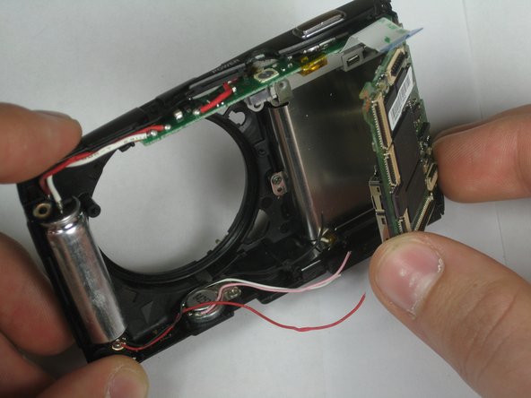 Disassembling Olympus Stylus 1010 Logic Board: step 14, image 1 of 2