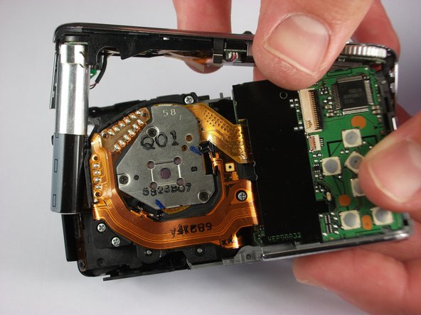 Panasonic Lumix DMC-FX01 On/ Off and Settings Button cover replacement: step 12, image 2 of 2