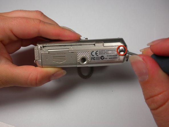 Olympus Stylus 410 Battery Cover Replacement: step 5, image 1 of 3