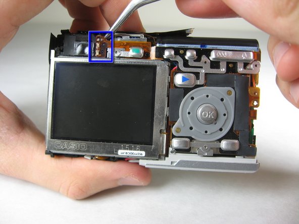 Disassembling Pentax Optio S4i Lens Assembly: step 9, image 1 of 3