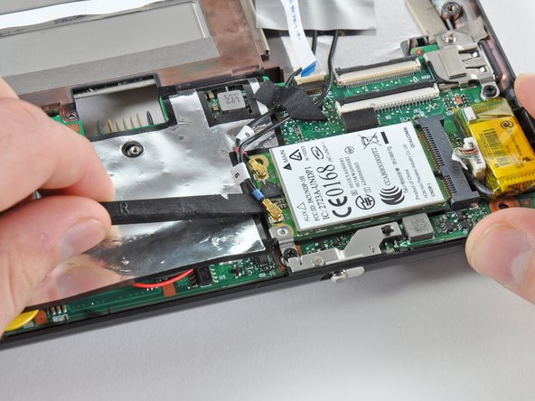 HP Mini 1000 Left Display Hinge Replacement: step 25, image 1 of 2