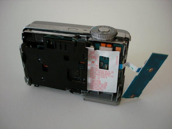 Sony Cyber-shot DSC-W5 battery compartment replacement: step 9, image 1 of 2