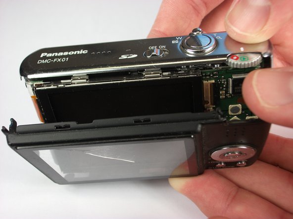 Panasonic Lumix DMC-FX01 On/ Off and Settings Button cover replacement: step 9, image 1 of 2