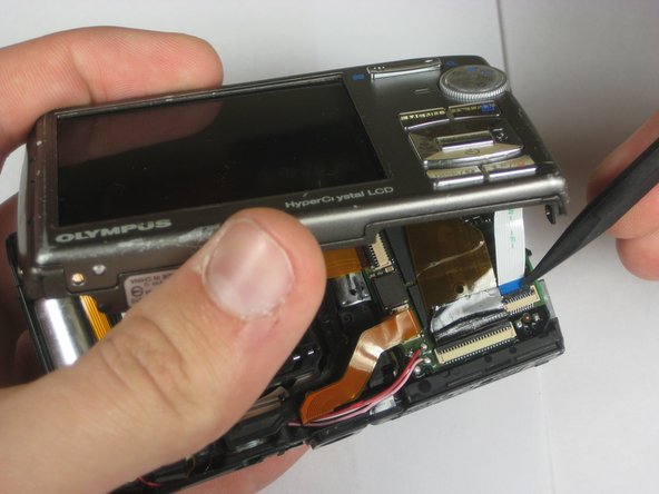 Disassembling Olympus Stylus 1010 Logic Board: step 7, image 3 of 3