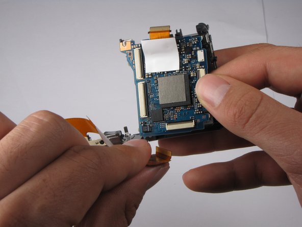 Repairing Sony Cyber-shot DSC-W290 Motherboard: step 23, image 2 of 3